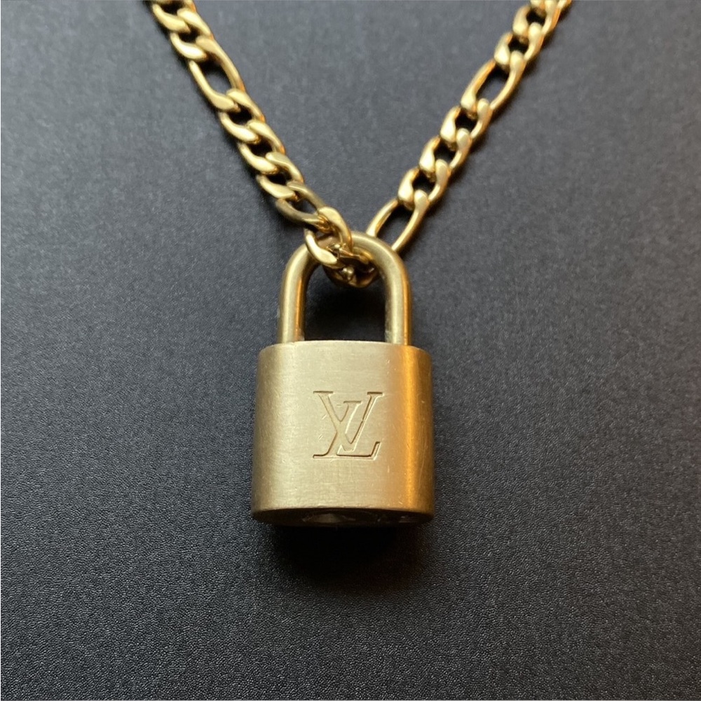Louis Vuitton lock and gold chain
